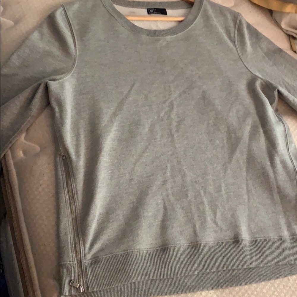 Gray long sleeve sweater.